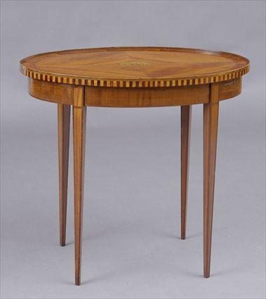 Appraisal: DUTCH NEOCLASSICAL INLAID WALNUT CENTER TABLE The oval veneered cross-banded