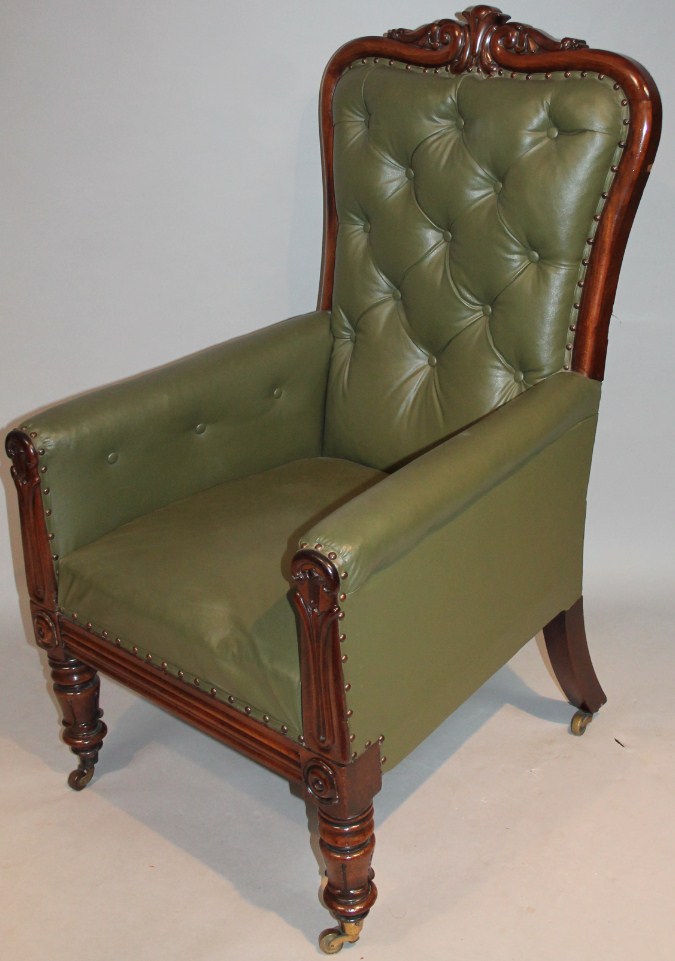 Appraisal: A thC mahogany framed button back armchair overstuffed in green