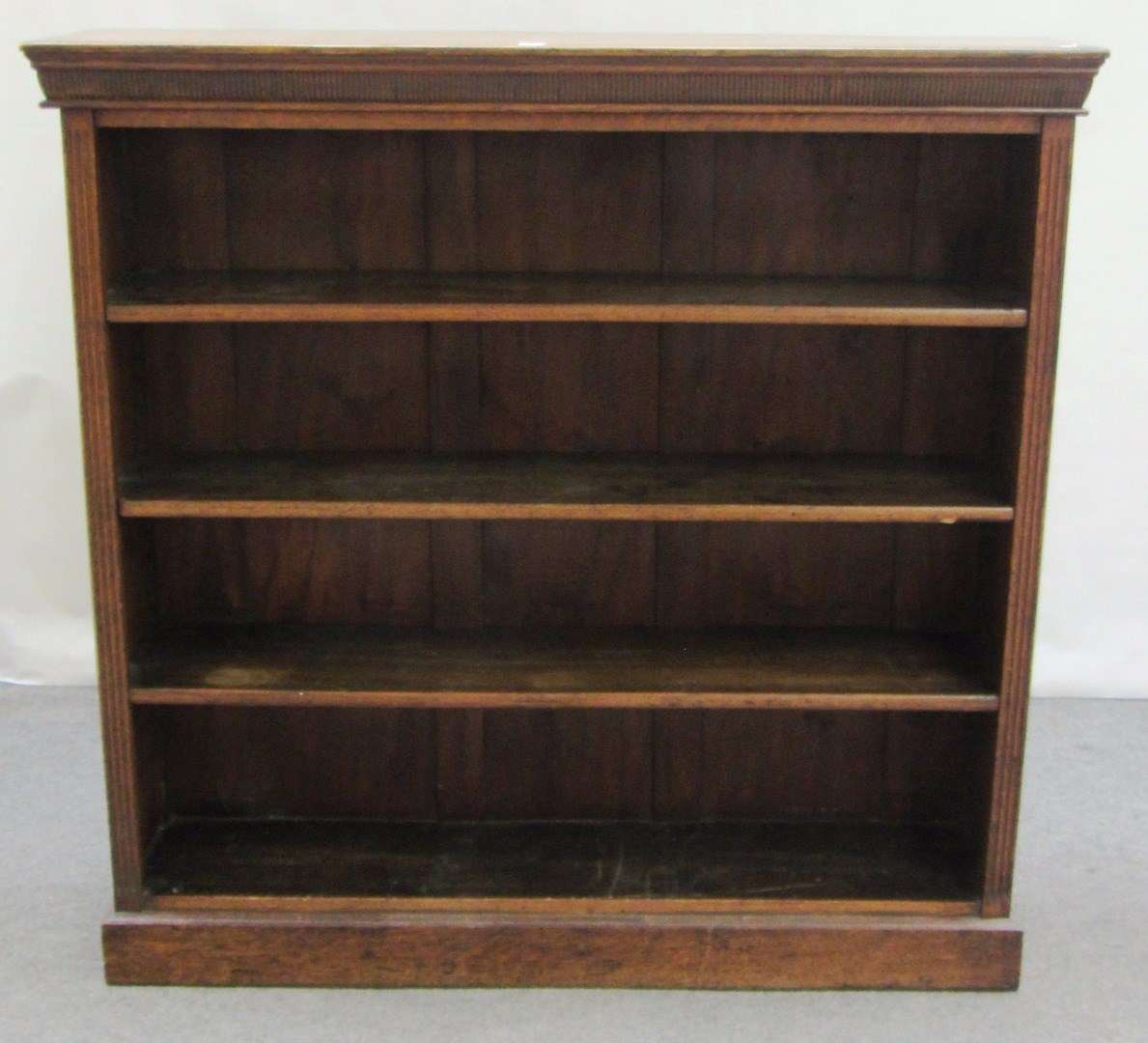 Appraisal: A th century oak floor standing open bookcase with channelled