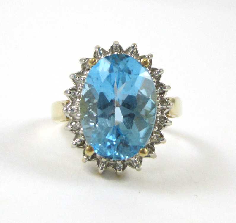 Appraisal: BLUE TOPAZ DIAMOND AND FOURTEEN KARAT GOLD RING with ten