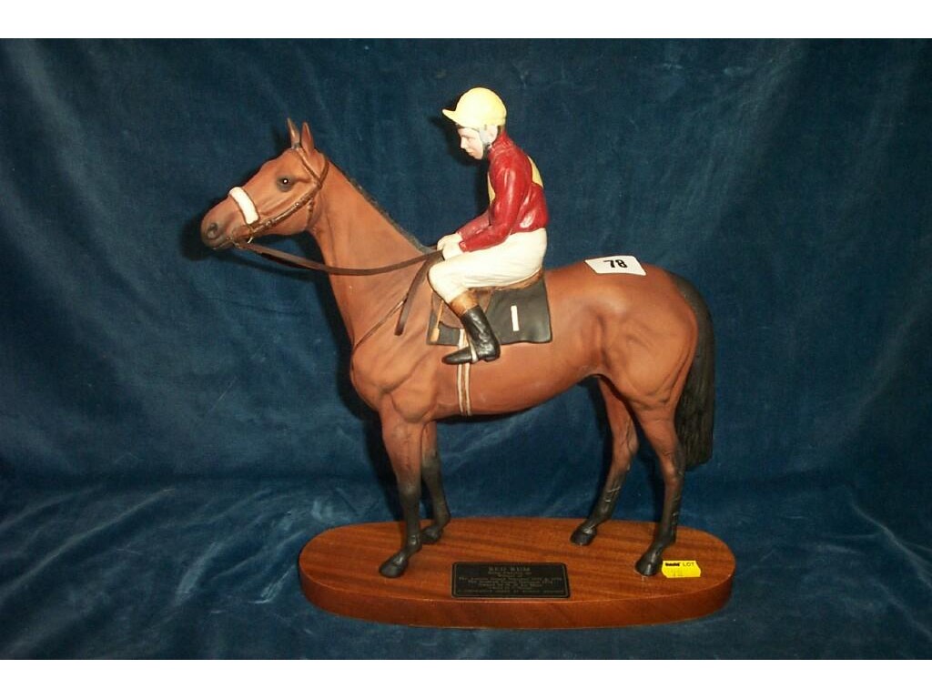 Appraisal: A Beswick matt glazed model of Red Rum with Brian