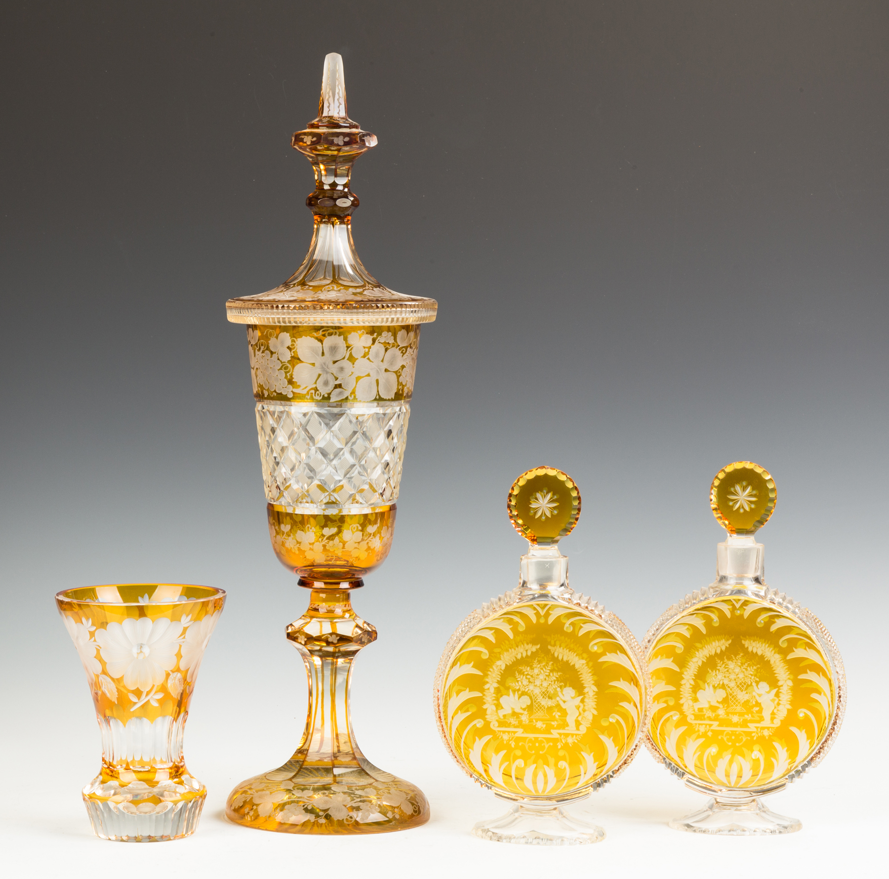 Appraisal: Bohemian Overlay Vase Covered Urn and Decanters th century Decanters