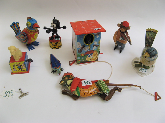 Appraisal: COLLECTION OF NINE TIN OTHER TOYS the tin toys include