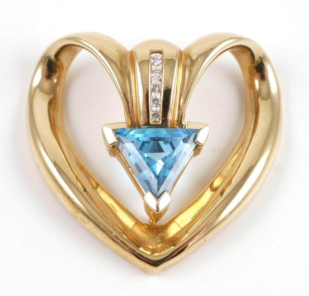 Appraisal: K yellow gold pendant contains triangle faceted blue topaz Ct