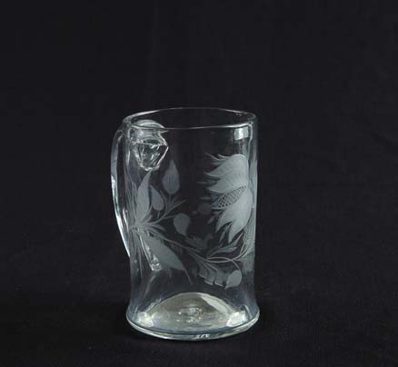 Appraisal: BLOWN ENGRAVED GLASS MUG Beautiful hand blown mug has engraved