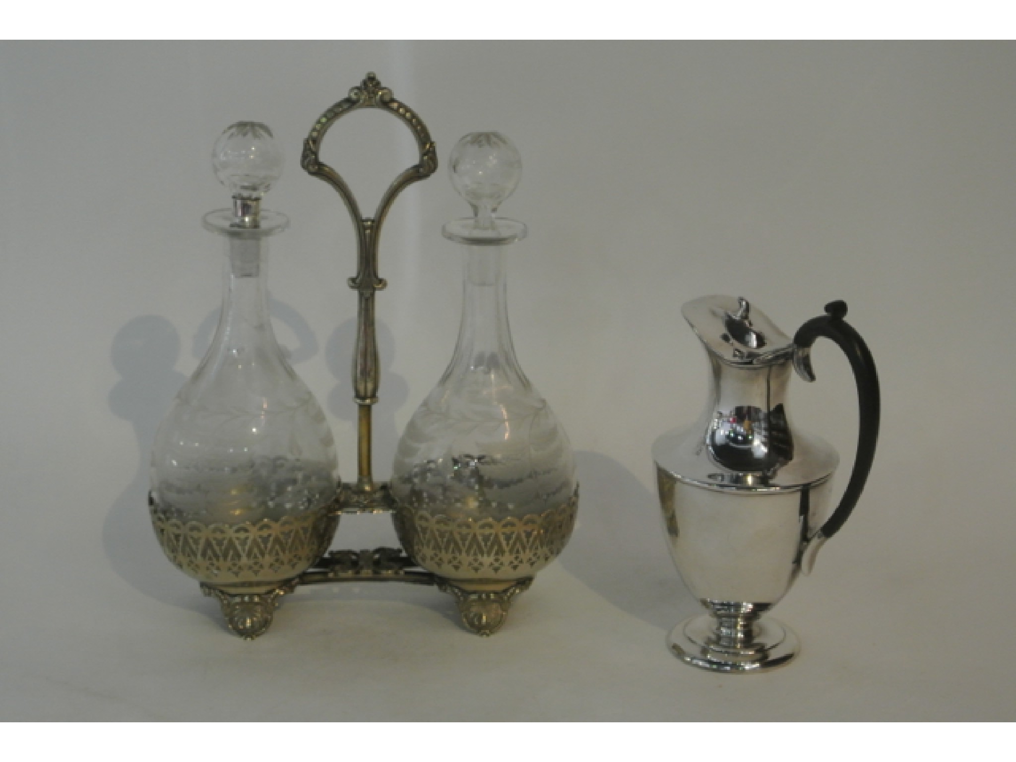 Appraisal: A Victorian two divisional silver plated decanter cruet stand accommodating