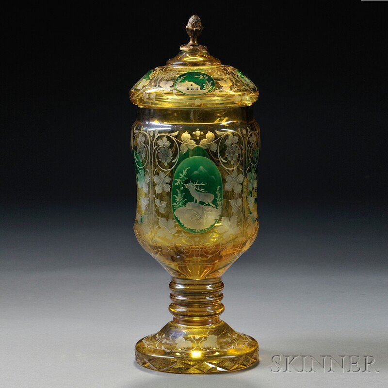 Appraisal: Bohemian Green-enameled and Etched Amber Flash Footed Jar with Cover