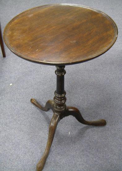 Appraisal: A th Century circular mahogany table raised on a turned