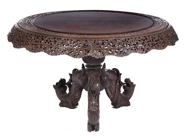 Appraisal: A TH CENTURY INDIAN CARVED PADOUK WOOD CENTRE TABLE with