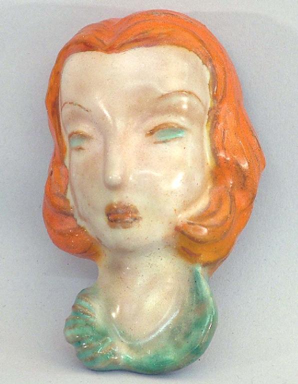 Appraisal: Goldscheider miniature terracotta glazed face wall mask of a lady