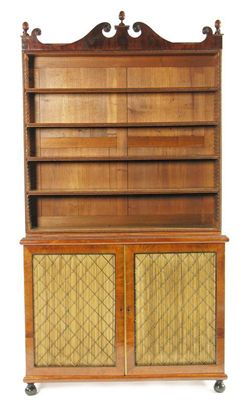 Appraisal: A George IV mahogany open bookcase cabinet the broken arch