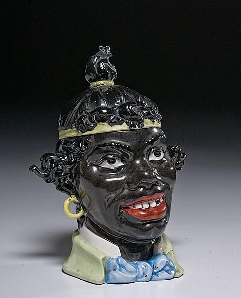 Appraisal: BLACKAMOOR MAJOLICA HUMIDOR late th century Continental of hand painted