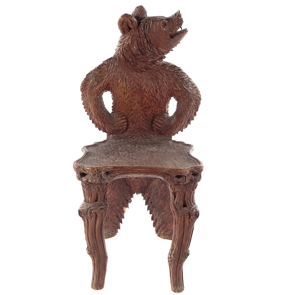 Appraisal: Black Forest Carved Walnut Child's Chair Germany th century bear-form