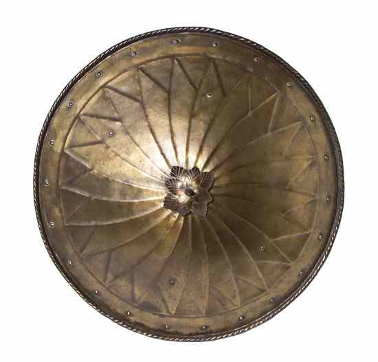 Appraisal: A Spanish Hammered Metal Circular Shield the central spike with