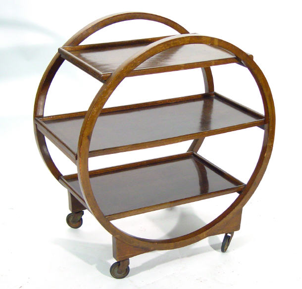 Appraisal: Art Deco walnut three tier tea trolley with circular supports