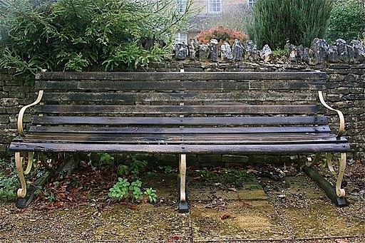 Appraisal: A large rectangular slatted garden seat with supports cm long