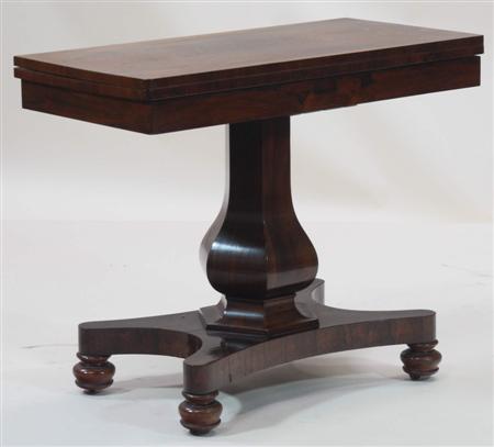 Appraisal: A Regency rosewood foldover tea table the rectangular top above