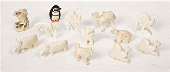 Appraisal: A Collection of Twelve Carved Ivory Animals comprising four camels