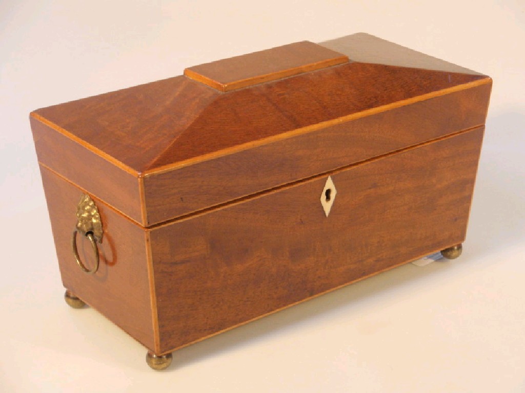 Appraisal: A Regency mahogany sarcophagus tea caddy with boxwood banding with