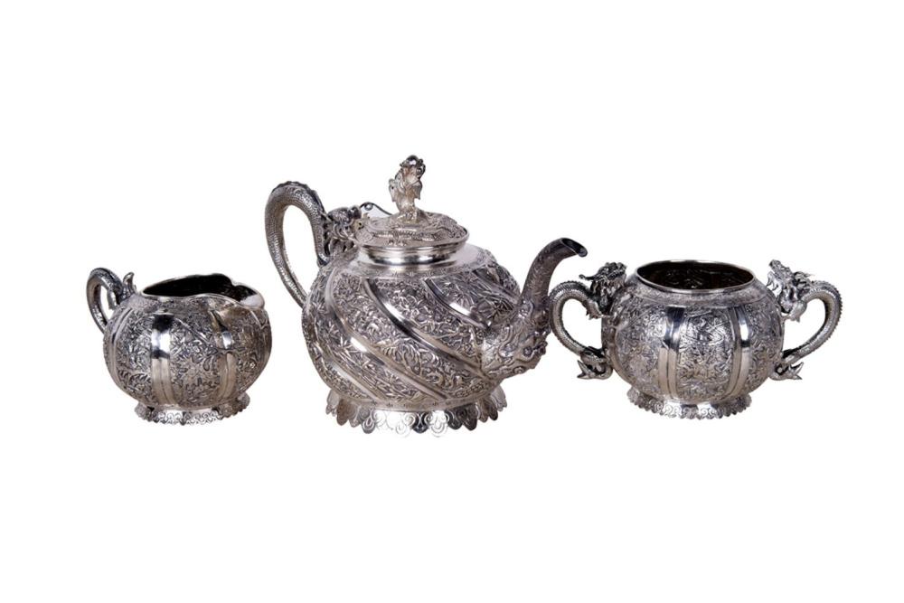 Appraisal: CHINESE SILVER TEA SERVICEcomprising a teapot a creamer and an