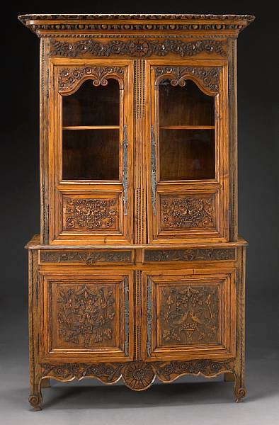 Appraisal: A French Provincial carved fruitwood buffet a deux corps late