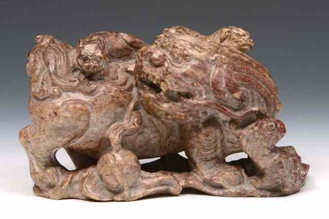 Appraisal: A CHINESE ALABASTER CARVED DOG OF FO with ball on