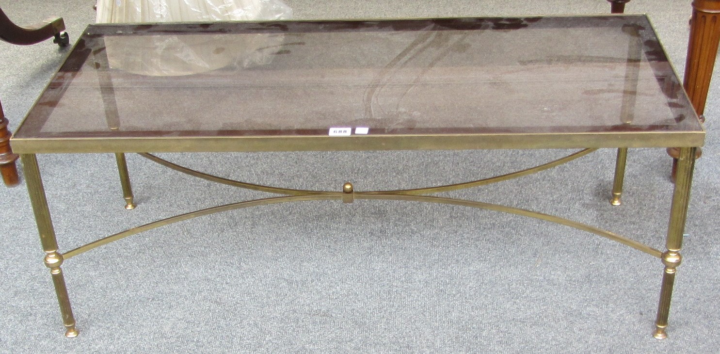 Appraisal: A th century rectangular lacquered brass coffee table with an