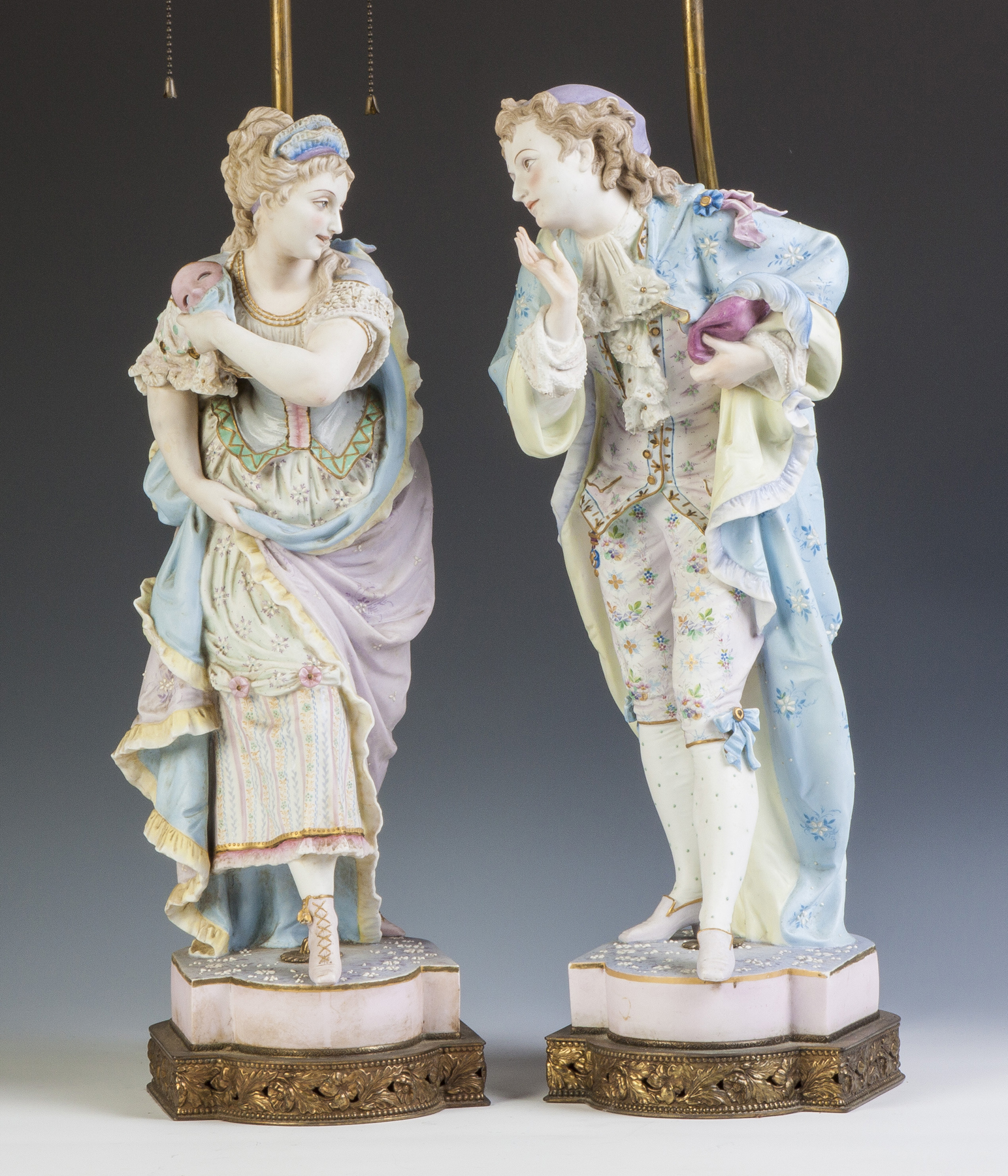 Appraisal: Hand Painted Bisque Masquerade Figures th cent Mounted as lamps