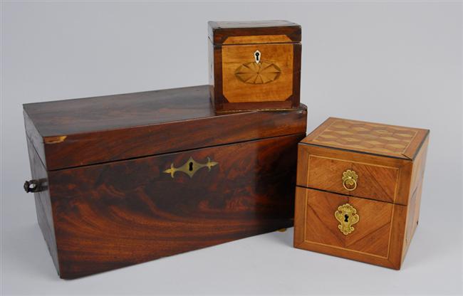 Appraisal: THREE GEORGIAN MAHOGANY TEA CADDIES satinwood inlaid length of largest