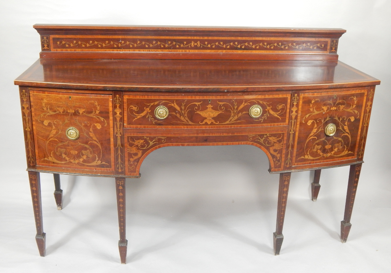 Appraisal: An Edwardian Hepplewhite style mahogany and inlaid bow front sideboard