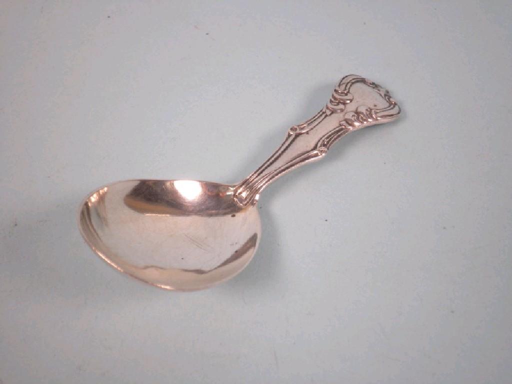 Appraisal: An inlaid Victorian silver caddy spoon with a scroll cast