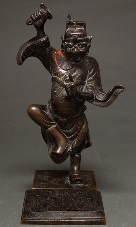 Appraisal: Chinese patinated bronze figure of a guardian Ch'ing Dynasty th