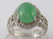 Appraisal: An carat white gold cabochon jade and diamond ring jade