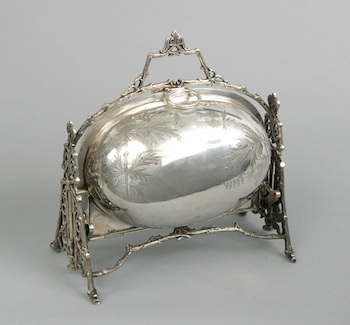 Appraisal: An Aesthetic Movement Silver Plated Bun Warmer The piece is