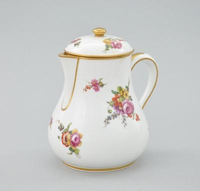 Appraisal: A Sevres Porcelain Covered Milk Pitcher Hand decorated around the