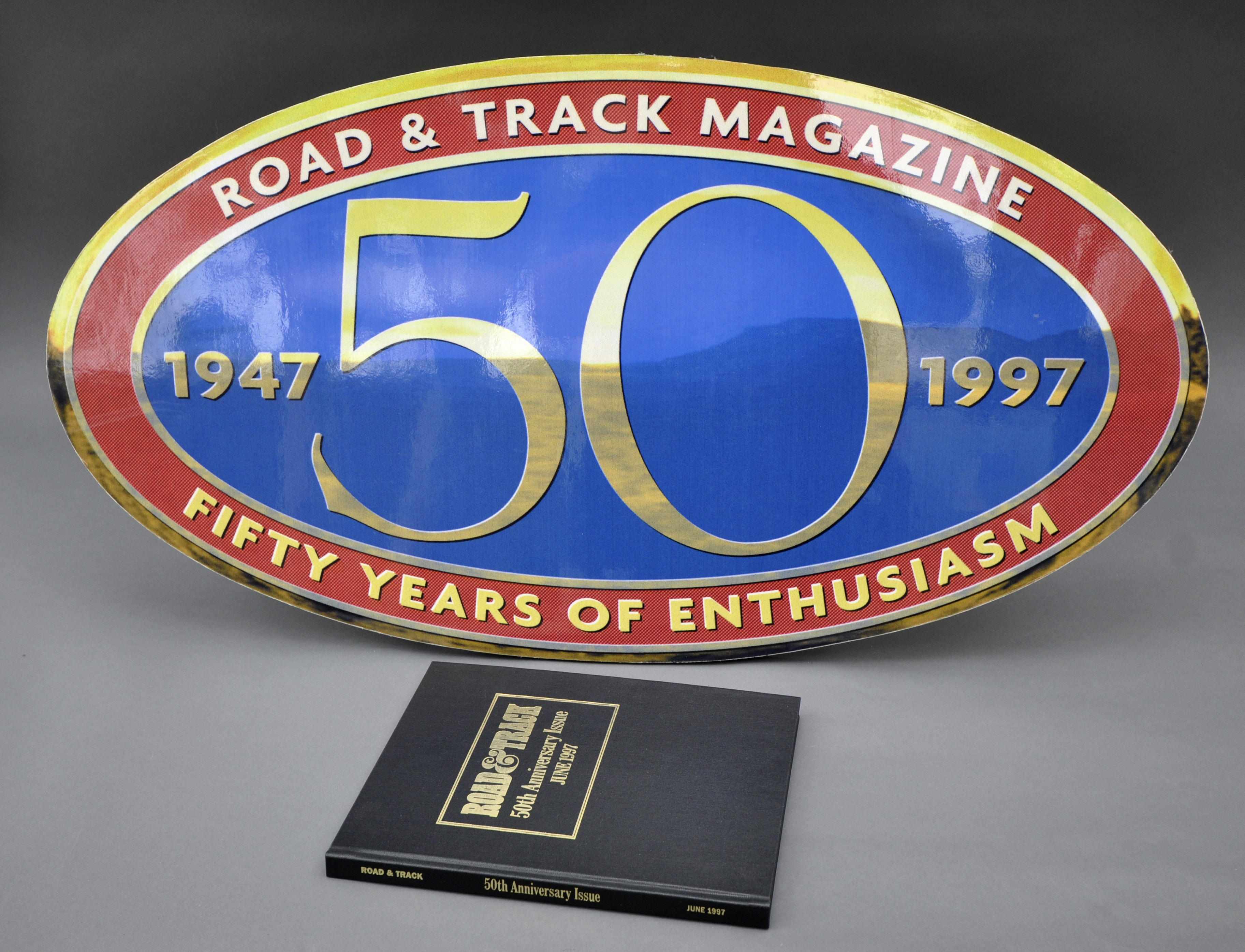 Appraisal: A Road Track th Anniversary wall hanging with hard-bound issue