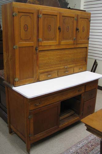 Appraisal: AN OAK HOOSIER KITCHEN CABINET American c The unusually wide