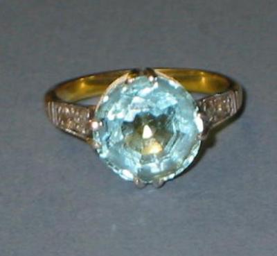 Appraisal: AN AQUAMARINE AND DIAMOND RING the round cut stone claw