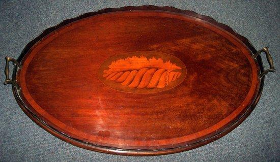 Appraisal: An Edwardian mahogany oval tray with galleried border inlaid a