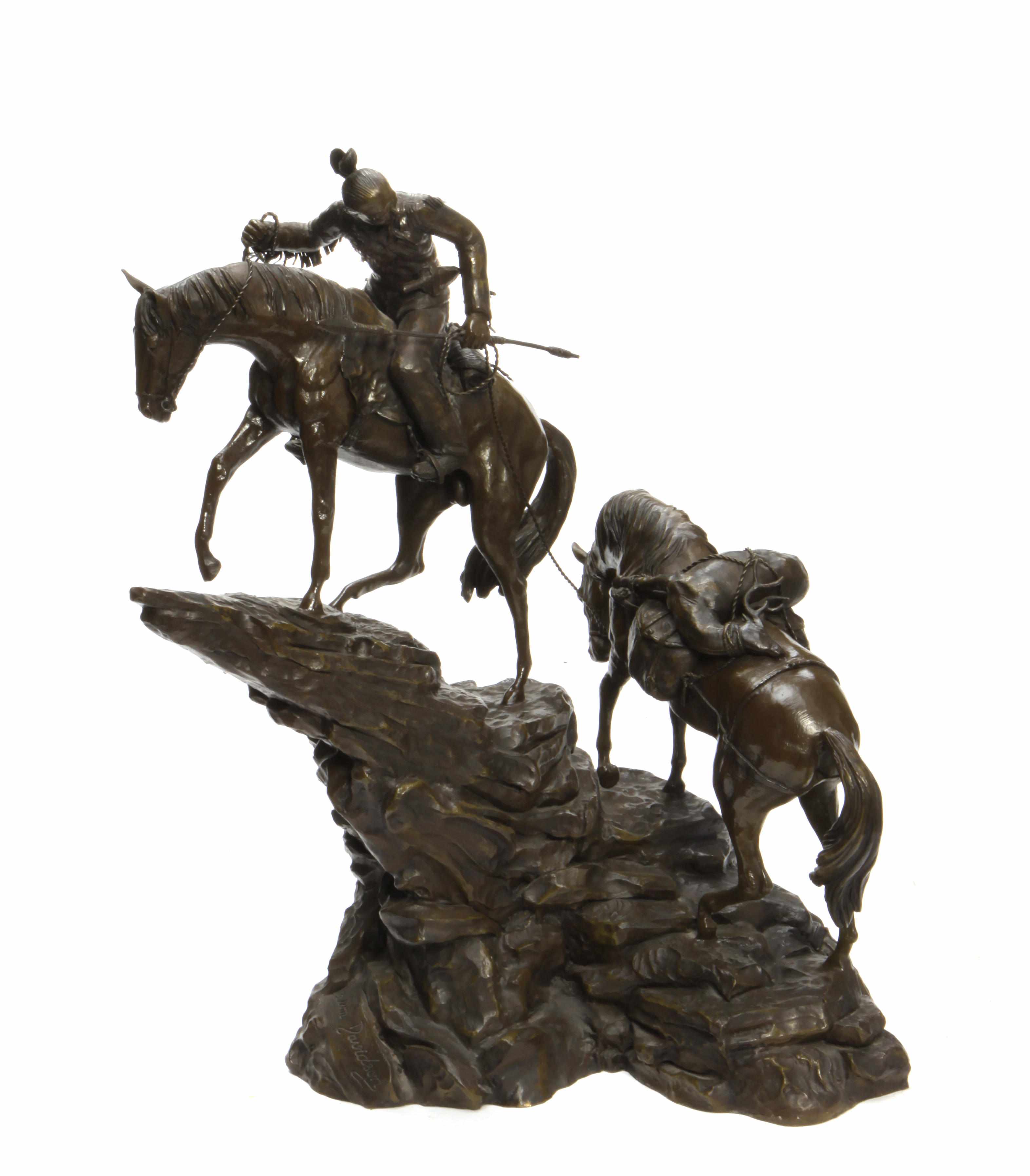 Appraisal: A patinated bronze equestrian figural group depicting a Native American