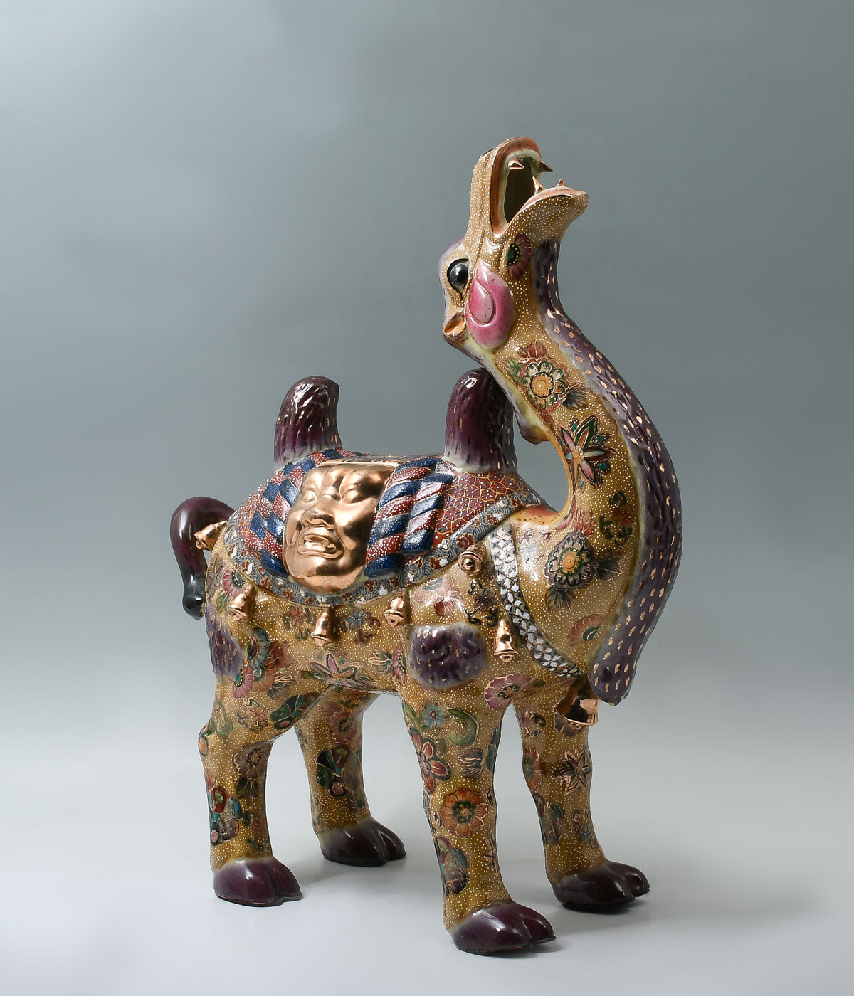 Appraisal: JAPANESE SATSUMA CAMEL STATUE Large porcelain camel with Dragon like