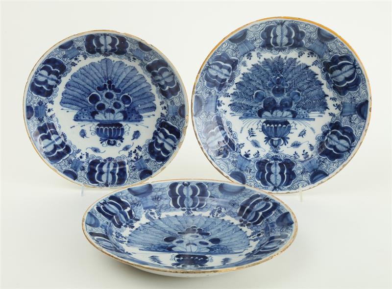 Appraisal: THREE DUTCH BLUE AND WHITE DELFT PEACOCK PLATES Variously marked