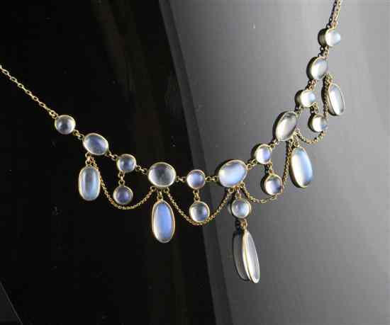 Appraisal: A gold mounted spectacle set moonstone fringe necklace in Estimate