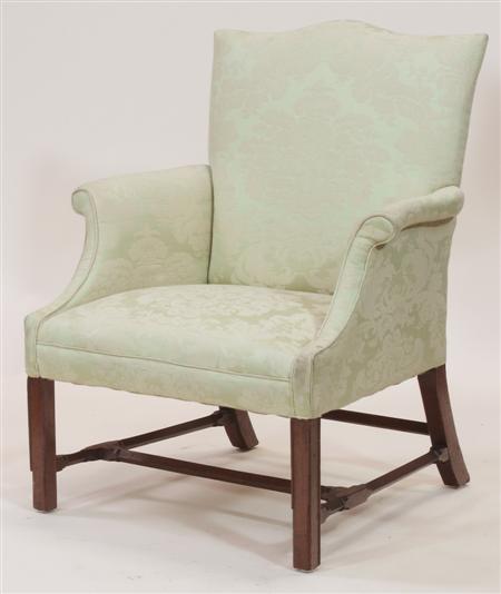 Appraisal: An early th century mahogany framed armchair the serpentine top-rail