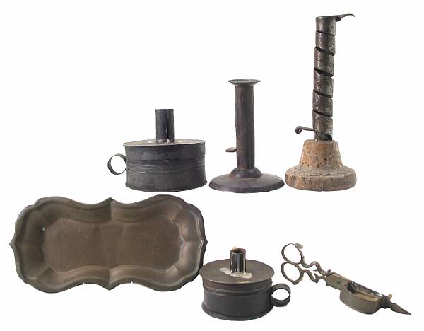 Appraisal: A group of brass and tin articles comprising two tinderboxes