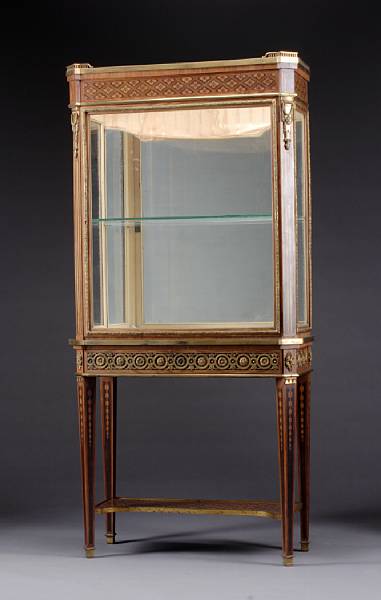 Appraisal: A Louis XVI style gilt bronze mounted inlaid walnut vitrine