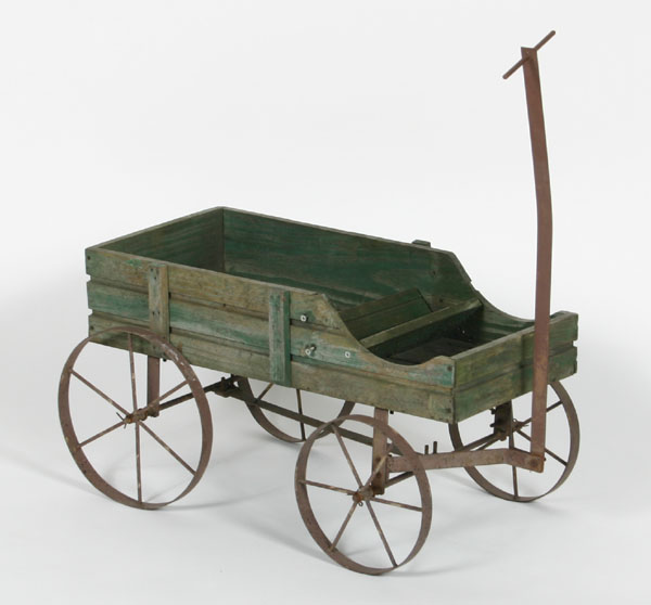 Appraisal: Primitive child's wagon with iron wheels metal framework and handle