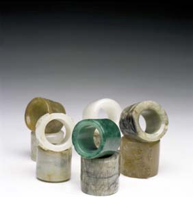 Appraisal: TEN JADE AND HARDSTONE ARCHER'S RINGS Collection of ten Chinese