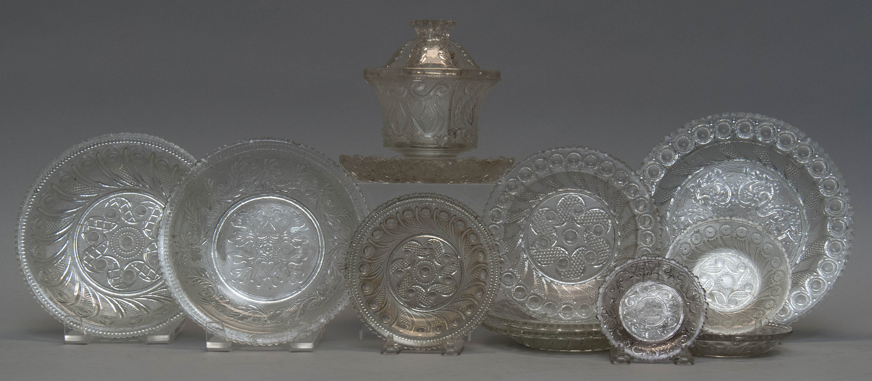 Appraisal: TWELVE PIECES OF AMERICAN LACY GLASS Including cup plates sauce