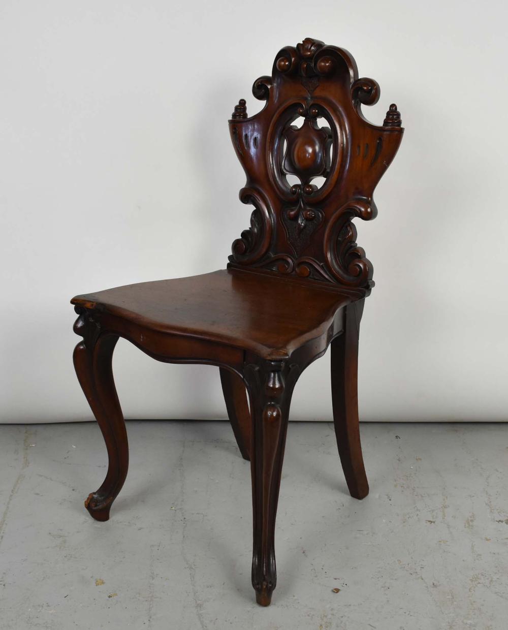 Appraisal: EARLY VICTORIAN MAHOGANY HALL CHAIRCirca The solid scroll-carved back with